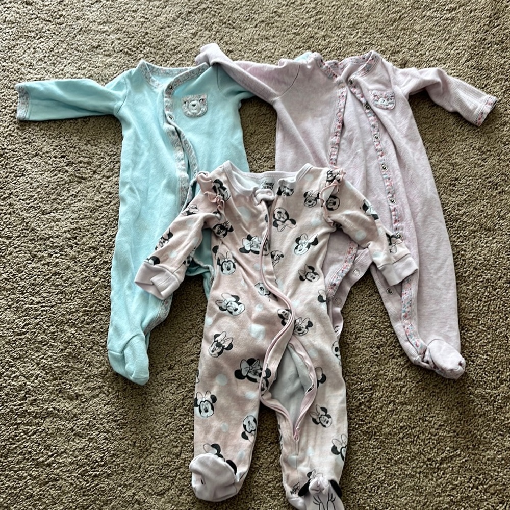 Three baby onesies